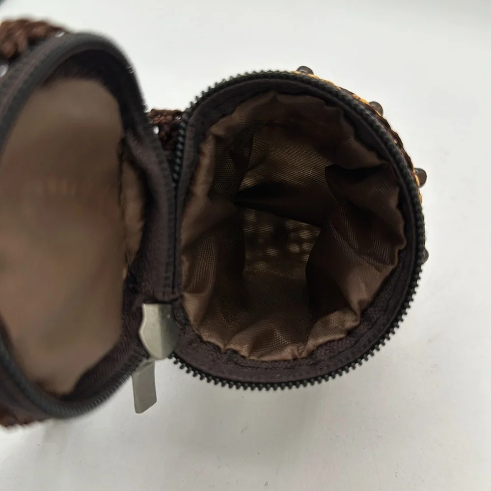 Handheld brown, tan, and black beaded coin purse